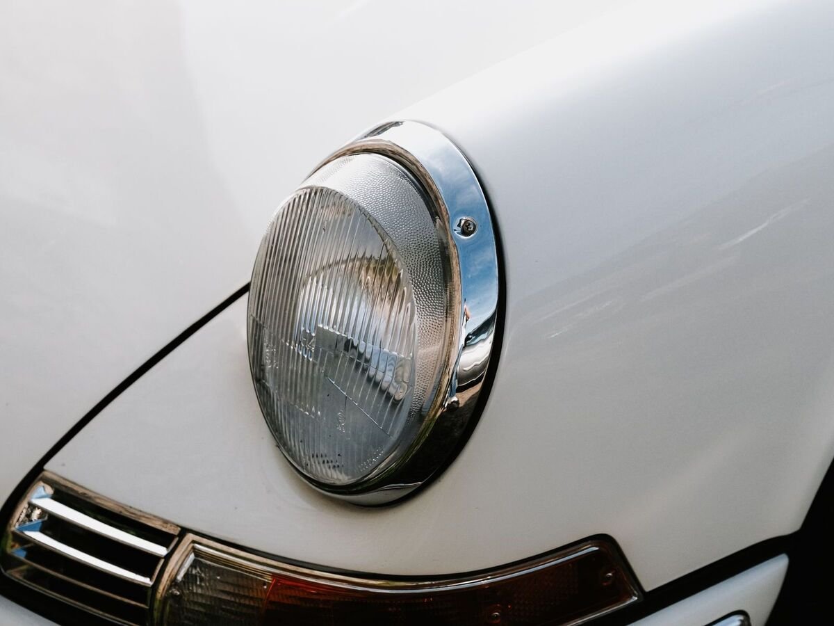 Chrome headlight detail of an enthusiast sports car