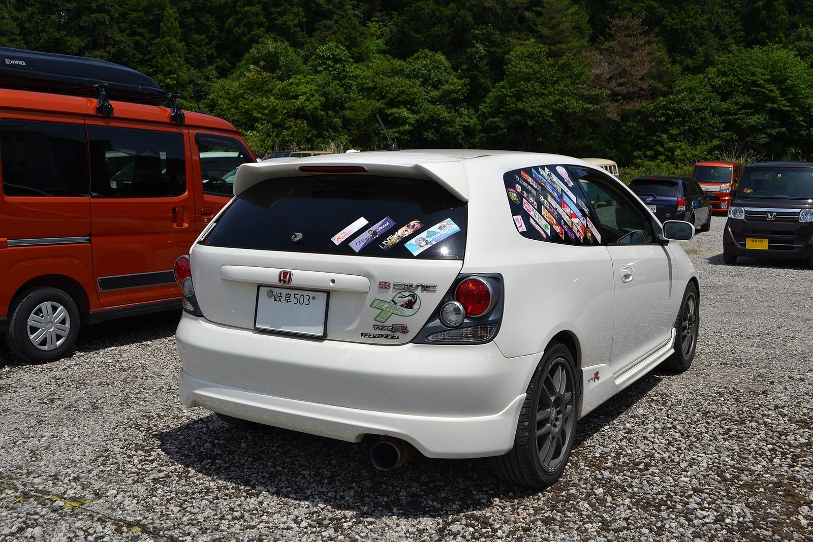 Rear three-quarter view of a Honda Civic Type R EP3 showing the rear wheel arches